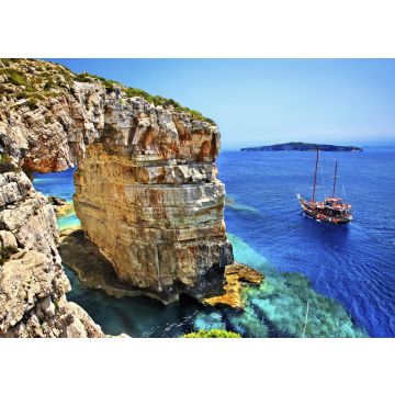 Lais Puzzle - Touristenboot auf dem Weg zum Trypitos (auch bekannt als "Kamara"), einem natürlichen Felsbogen auf der Insel Paxos, Ionisches Meer, Griechenland. Im Hintergrund die Insel Antipaxos - 100, 200, 500 & 1.000 Teile