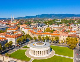 Lais Puzzle - Drohnenaufnahme des Mestrovic-Pavillons, der monumentalen Kunstgalerie und des Stadtzentrums an einem sonnigen Sommertag, Zagreb, Kroatien - 40, 100, 200, 500, 1.000 & 2.000 Teile