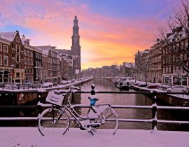 Lais Puzzle - Stadtbild vom verschneiten Amsterdam mit der Westerkerk in den Niederlanden bei Sonnenuntergang - 40, 100, 200, 500, 1.000 & 2.000 Teile